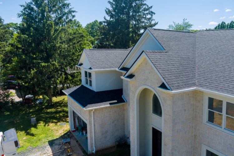A large home with a prominent roof representing GAF Master Elite in Santa Cruz & Monterey Counties