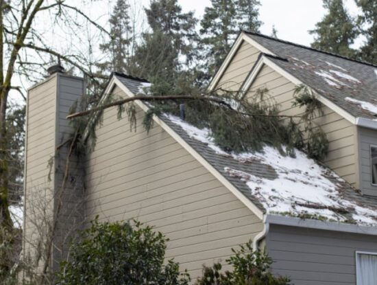A damaged roof house illustrates storm damage safety in Santa Cruz and Monterey Counties
