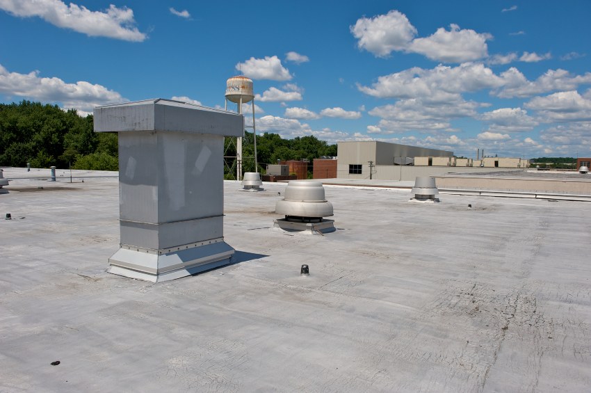 Commercial flat roof with vents highlighting roof repair in Santa Cruz & Monterey Counties